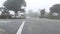 Suburban residential district street, foggy misty road rainy weather, California