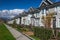 Suburban residential street townhomes. On bright sunny spring day against bright blue sky.