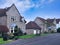 Suburban residential street with two story stone houses