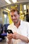 Subway businessman texting sms on smartphone app