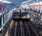 Subway cars passing each other on the Williamsburg Bridge from Brooklyn to Manhattan in New York City NYC