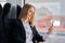 Subway commuter business woman on public transport using smartphone