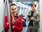 Subway passengers with phones