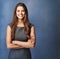 Succeeding with purpose and passion. Studio portrait of a confident young businesswoman posing against a grey background