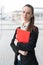 Succesful confident business woman holding folder