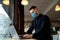 Succesfull businessman working in medical mask. Quarantine indoor work. Portrait male in mask.