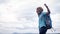 Success African tourist  traveler man with backpack on view of mountain background