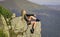 success concept. mountain traveling and hiking. rock climbing. mountaineering lover. reaching the top. woman relax on