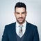 Success has always been destined for me. Studio portrait of a handsome young businessman posing against a grey