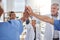 Success, high five or nurses in meeting for a strategy, goals or working in hospital for healthcare. Hands together