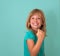 Success. Portrait winning successful little girl happy ecstatic celebrating being winner isolated turquoise background. Positive