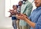 Success should always be celebrated. Cropped shot of a team of designers applauding together in an office.