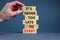 Success start symbol. Wooden blocks with words `It is never too late to start`. Businessman hand. Beautiful grey background, cop