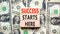 Success starts here symbol. Concept word Success starts here on beautiful wooden block. Dollar bills. Beautiful dollar bills