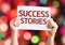 Success Stories card with colorful background with defocused lights