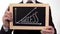 Success up arrow graphic drawn on blackboard in businessman hands, motivation