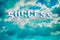 Success. Word in the cloudy sky. Success concept. Baner. Background. Business.