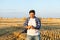 Successful agriculturist in field of wheat. harvest time