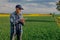 Successful Agronomist Touching Wheat Crops and Examining Agriculture Field