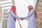 Successful Arabic business people shaking hands