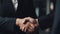 Successful business agreement between two well dressed professionals shaking hands generated by AI