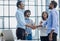 Successful Business Collaboration: Executives Greet with Handshake in Office