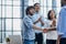 Successful Business Collaboration: Executives Greet with Handshake in Office