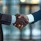 Successful business partnership handshake between businessmen in office setting