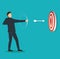 Successful businessman aiming target with bow and arrow