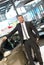 Successful businessman in a car dealership - sale of vehicles to