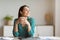 Successful Businesswoman Having Coffee At Workplace Sitting In Office