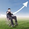 Successful disabled businessman with upward arrow