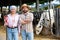 Successful farm family in cowshed