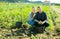 Successful farm family during potatoes harvest