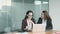 Successful female colleagues talking, video chatting via laptop