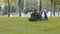 Successful freelancer business man teacher student african american guy lying on green grass lawn park having online