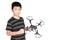 Successful happy and attractive Asian boy holding hexacopter drone and punching the air with his fist, isolated on white.