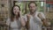 Successful happy millennial couple celebrating the achievement cheering and dancing -