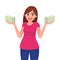 Successful happy young business woman holding cash / money / currency / banknote bundle in hands. Business and finance concept.