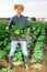Successful horticulturist with savoy cabbage on farm plantation