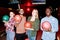 Successful intercultural bowling players with balls standing in front of camera