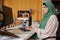 Successful Muslim Woman as Female Programmer Coding in Office