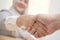 Successful negotiate and handshake concept, Asian muslim businesswoman shake hand with partner to celebration partnership and