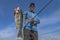 Successful perch fishing. Happy fisherman hold big perch fish