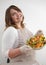 successful promotional photo of beautiful curvy woman preparing salad diet for weight loss beige apron Same color