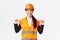 Successful proud smiling asian female construction manager, engineer in safety helmet pointing at herself, show-off