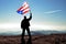 Successful silhouette man winner waving Puerto Rico flag on top of the mountain