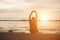 Successful sportsman raising arms on golden sky back lighting sunset summer after cross running. Fitness male athlete with arms up