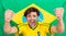 Successful Sportsman Shouting Against Brazilian Flag