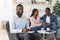 Successful Therapy. Smiling Counselor Posing With While Happy Black Spouses On Background